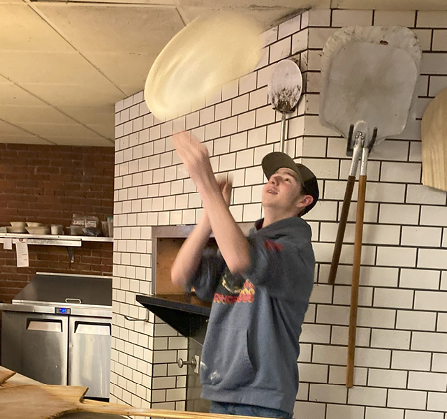Tossing a pizza crust